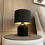 Lámpara de mesa de acero negro y dorado Elira